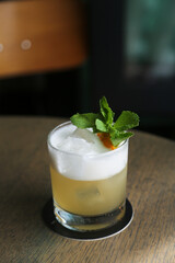 Refreshing citrus cocktail with egg white foam