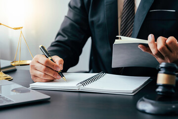law concept, lawyer man holding pen with contract or agreement document to the customer for signing...