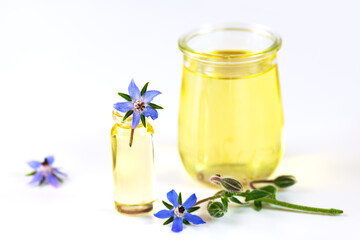 Borage oil for skin care and health in glass jars.