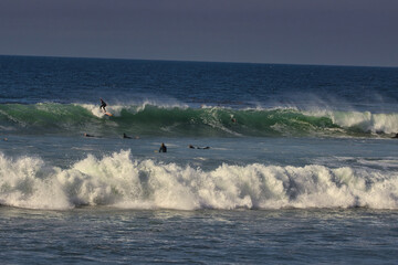 Surfing big summer waves at Leo Carrillo state beach