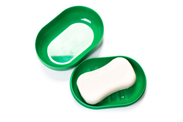 Travel soap in plastic soap dish isolated on white background