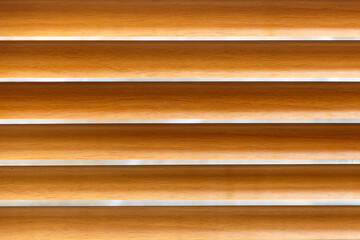 Horizontal blinds are brown in color. The background image