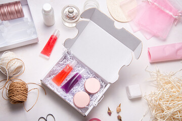 Obraz na płótnie Canvas Set of homemade lip gloss in cardboard box