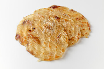 Dried filefish fillet on white background