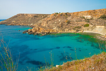 Scenic Coastline of Malta. Static View, Fomm Ir-Rih Bay, Turquoise Mediterranean Sea and Rocky Cliffs on Sunny Day