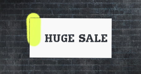 Fototapeta premium Huge sale stencil painted in green on brick wall 4k