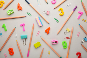 School supplies on grey background. Back to school concept.