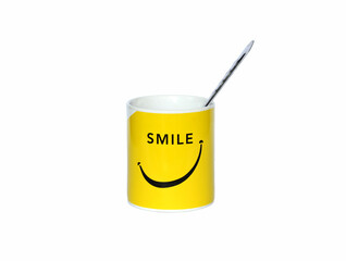 Smile yellow cup on white background.