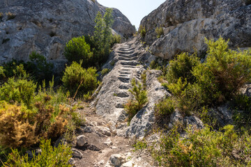 Fototapeta na wymiar Staircase carved into the rock to facilitate the passage through the mountain.