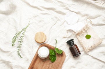 Sustainability concept cosmetic background brown glass veil with product flat lay green natural beauty bblog concept