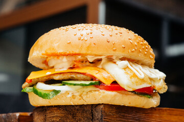juicy burger with filling, cheese, meat