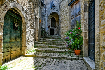 Fototapeta na wymiar Carpineto Romano, Italy, July 24, 2021. A street in the historic center of a medieval town in the Lazio region.