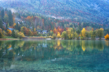 Amazing nature autumn landscape, Jasna lake in Triglav national park, Kranjska Gora, Slovenia. Scenic view of crystal clear pond with reflection, tourist resort, outdoor travel background