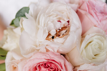 wedding rings on flowers