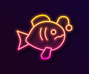 Glowing neon line Tropical fish icon isolated on black background. Exotic fish. Vector