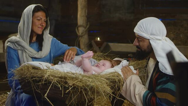 Mary and Joseph admiring son of God nativity scene