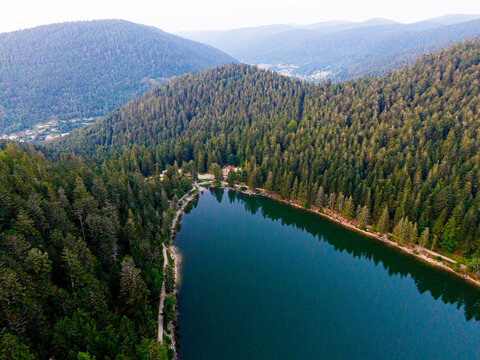 Aerial view of the Lac des corbeaux surrounded by forest, Voges, La Bresse, Lake Crows