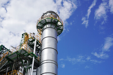 Stack of gas turbine power plant is part of the chemical production process at olefin factory.