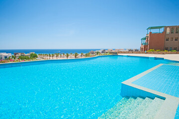 Outdoor swimming pool in a luxury tropical hotel resort