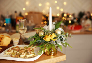 Wine glasses and beautiful food decoration. Romantic fine dining. Luxury romantic candlelight dinner table setup for couple. Stylish table setting with burning candles and Christmas decorations.