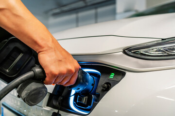 man starting his electric vehicle