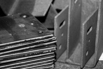 a stack of metal parts at the factory in the shop