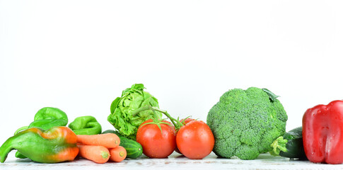 Healthy food, fresh assorted vegetables and tomatoes, isolated, on white background and copy space.