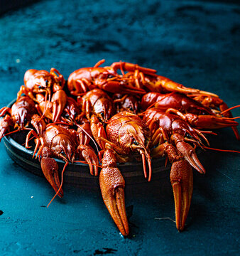 boiled crayfish on a dark background