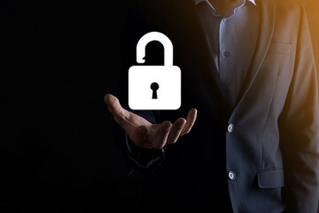 Businessman holds an open padlock icon on his palm.unlocking a virtual lock. Business concept and technology metaphor for cyber attack, computer crime, information security and data encryption.