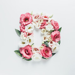 Fototapeta na wymiar Letter D made with flower and leaves on bright white background. Floral mother's day alphabet concept. Spring blossom, valentine or romantic font collection. Flat lay, top view.