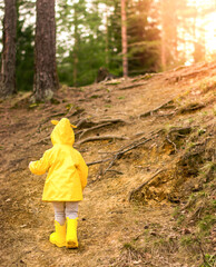 The child runs through the forest