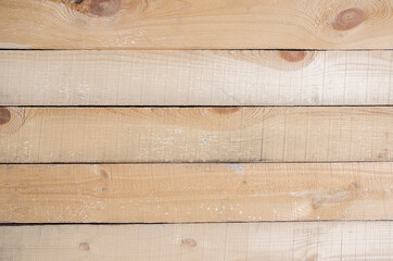 Wooden surface of the table or floor.