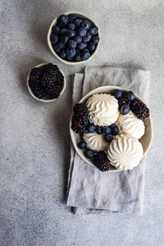 Zefir dessert with blueberries and blackberries on a table
