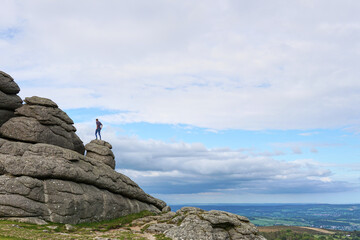 Haytor Rocks, Dartmoor's most famous landmark, is a granite tor on the eastern edge of Dartmoor in Devon, UK. sunny day.