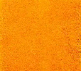 Warm soft yellow plaid surface close up. Synthetic cloth texture.