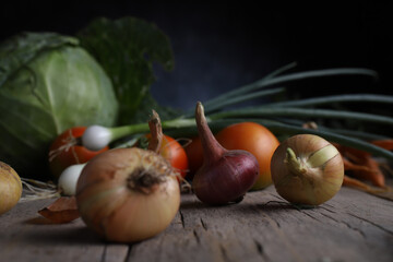 autumn harvest of garden crops on a vintage wooden table