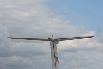 Airplane tail. Airplane against the background of clouds.