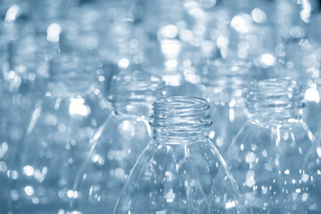 The empty PET bottles  on the conveyor belt for filling process in the drinking water factory.