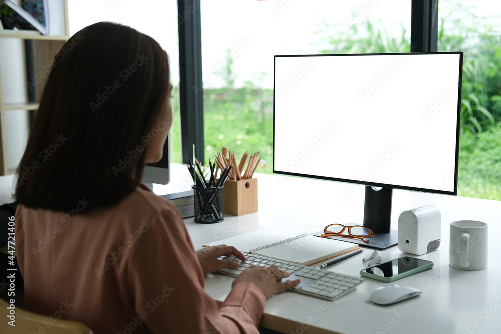 Poster closed up with businesswoman working with computer pc, blank screen of display computer.