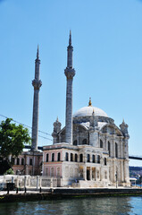 Fototapeta na wymiar View of a beautiful mosque with two minarets. July 10, 2021, Istanbul, Turkey.