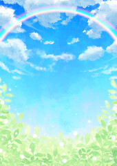 虹のかかる青空と雲と輝く葉っぱ