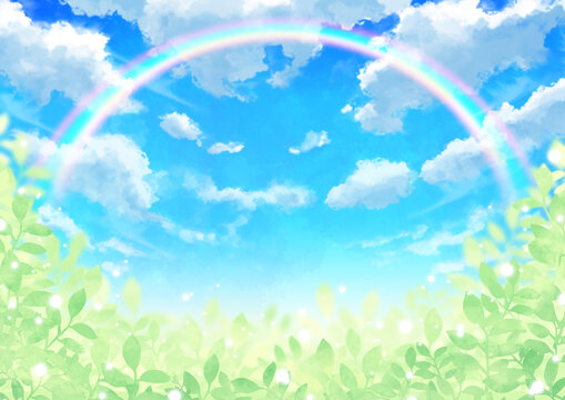 虹のかかる青空と雲と輝く葉っぱ