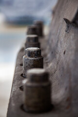 Close up photo of steam turbine cast iron body cover. Old rusted bolts. Low depth of field. Atyrau,Kazakhstan.