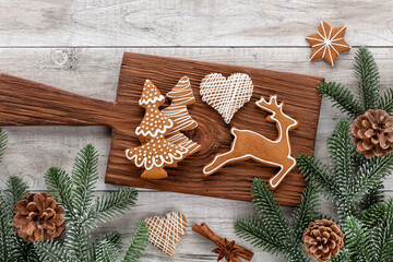 Homemade christmas gingerbread cookies on wooden table.