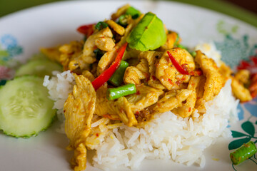 Chicten Stir Fried Chili with kaffir lime leaves and lentils over rice for a delicious lunch.Food Thai
