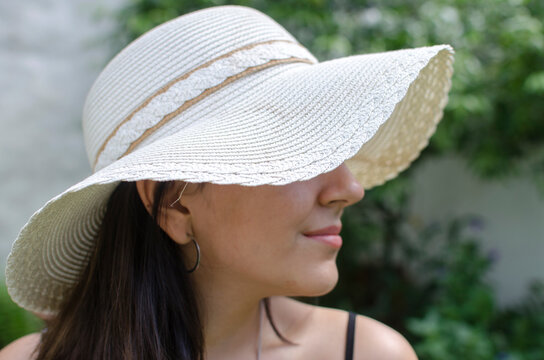 Portrait of a teenage girl wearing a capelin style hat