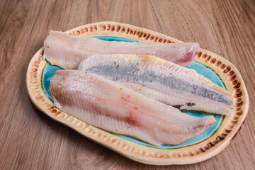 herring fillet marinated in brine on a plate