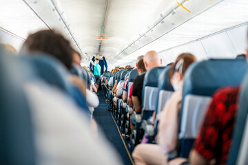 Aircraft cabin with passengers during the flight