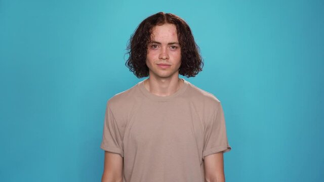 Portrait of Attractive Young man says Never Look Back for people who are deaf and hard of hearing. Motivational phrase for Deaf and dumb people use sign language
