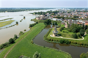 Fototapeta na wymiar Aerial from the city Woudrichem at the river Merwede in the Netherlands in a flooded landscape